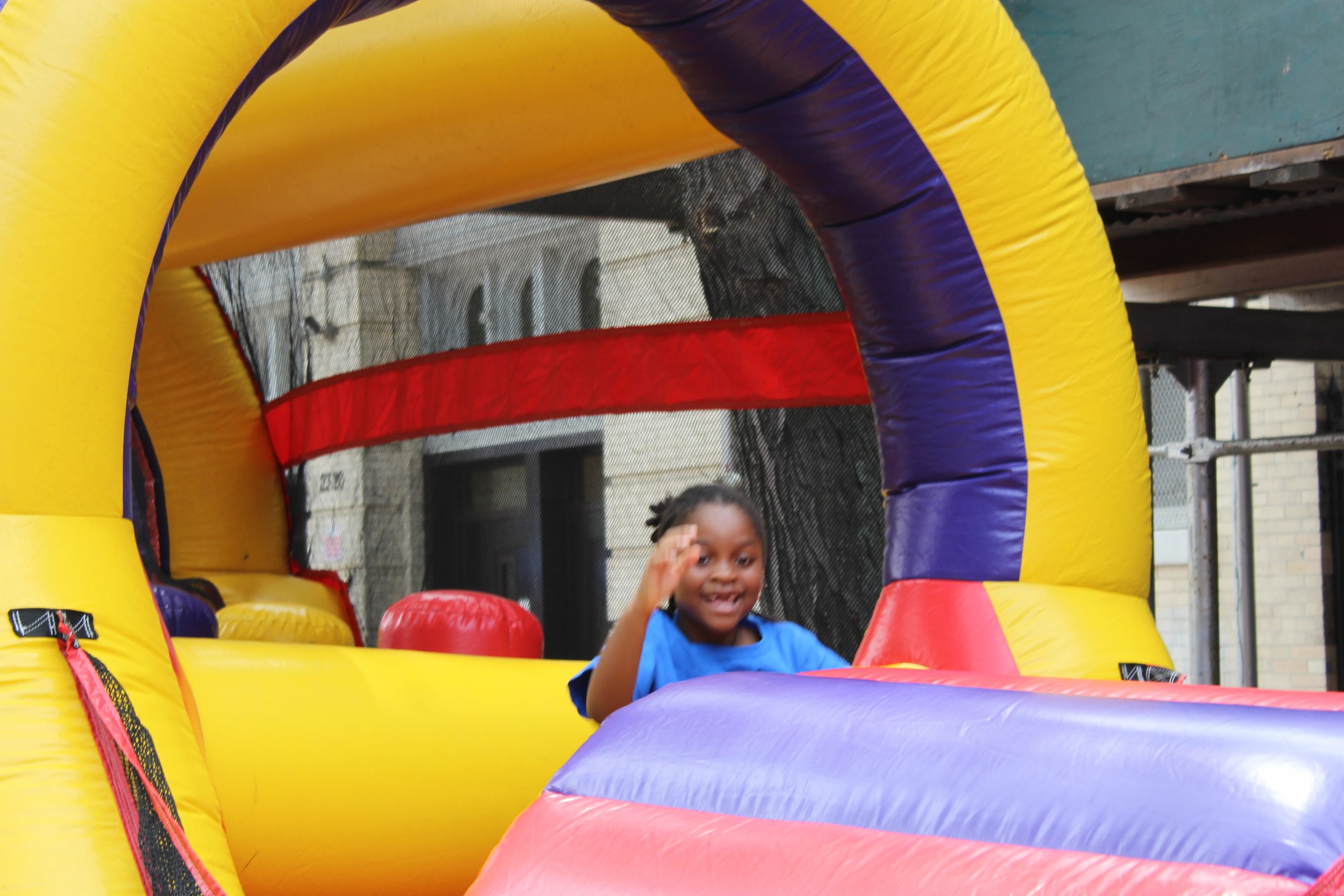 little girl in an inflated castle having fun during Kids fun day 2019