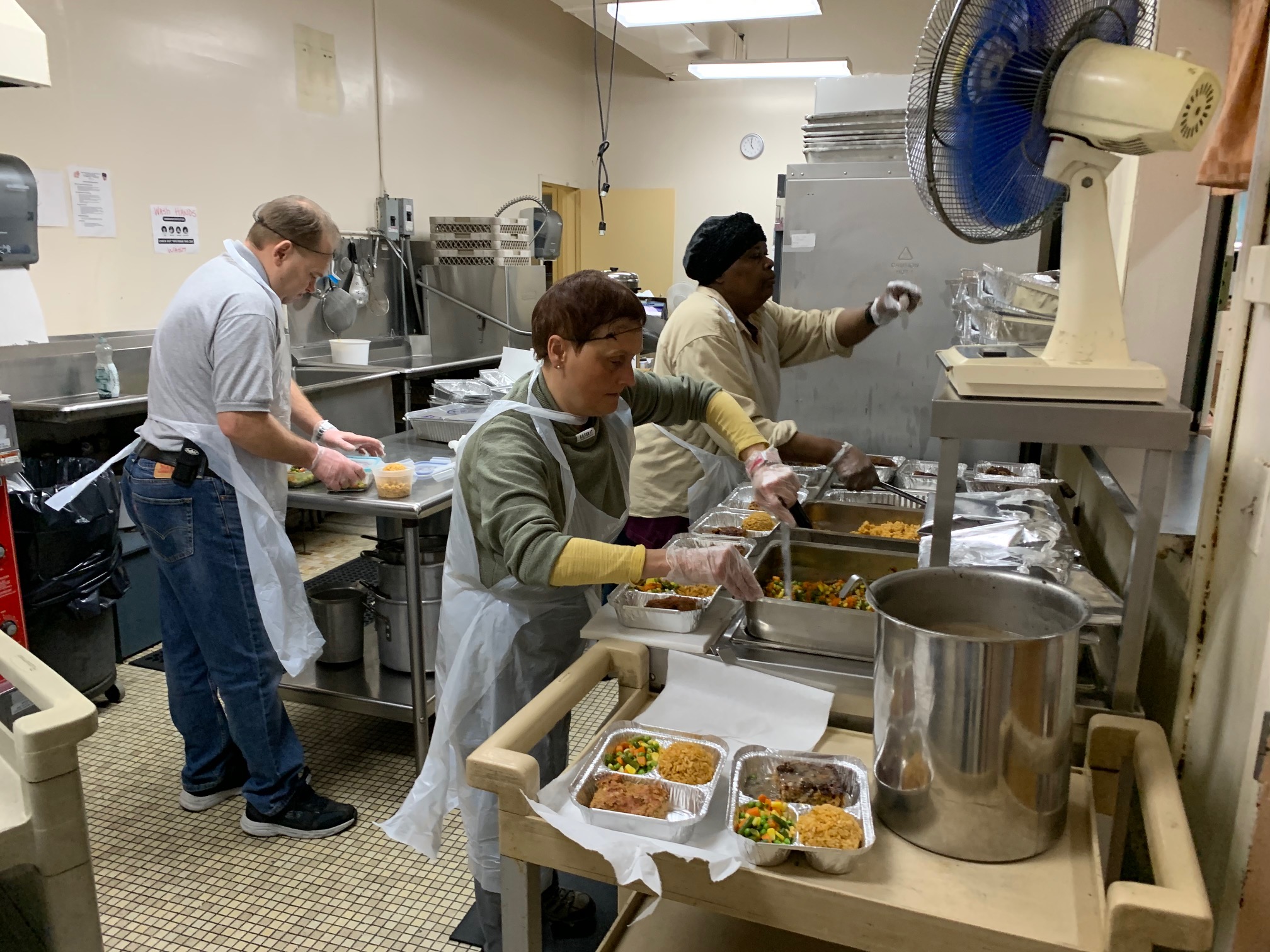 catholic charities helps making food for the senior community members