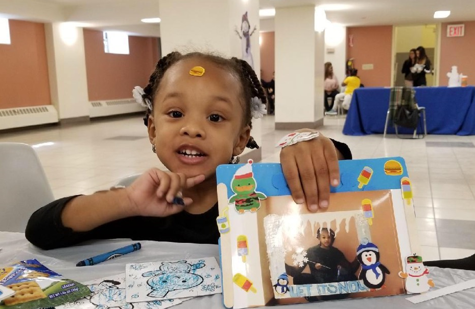 little girl having fun during winter fun time event