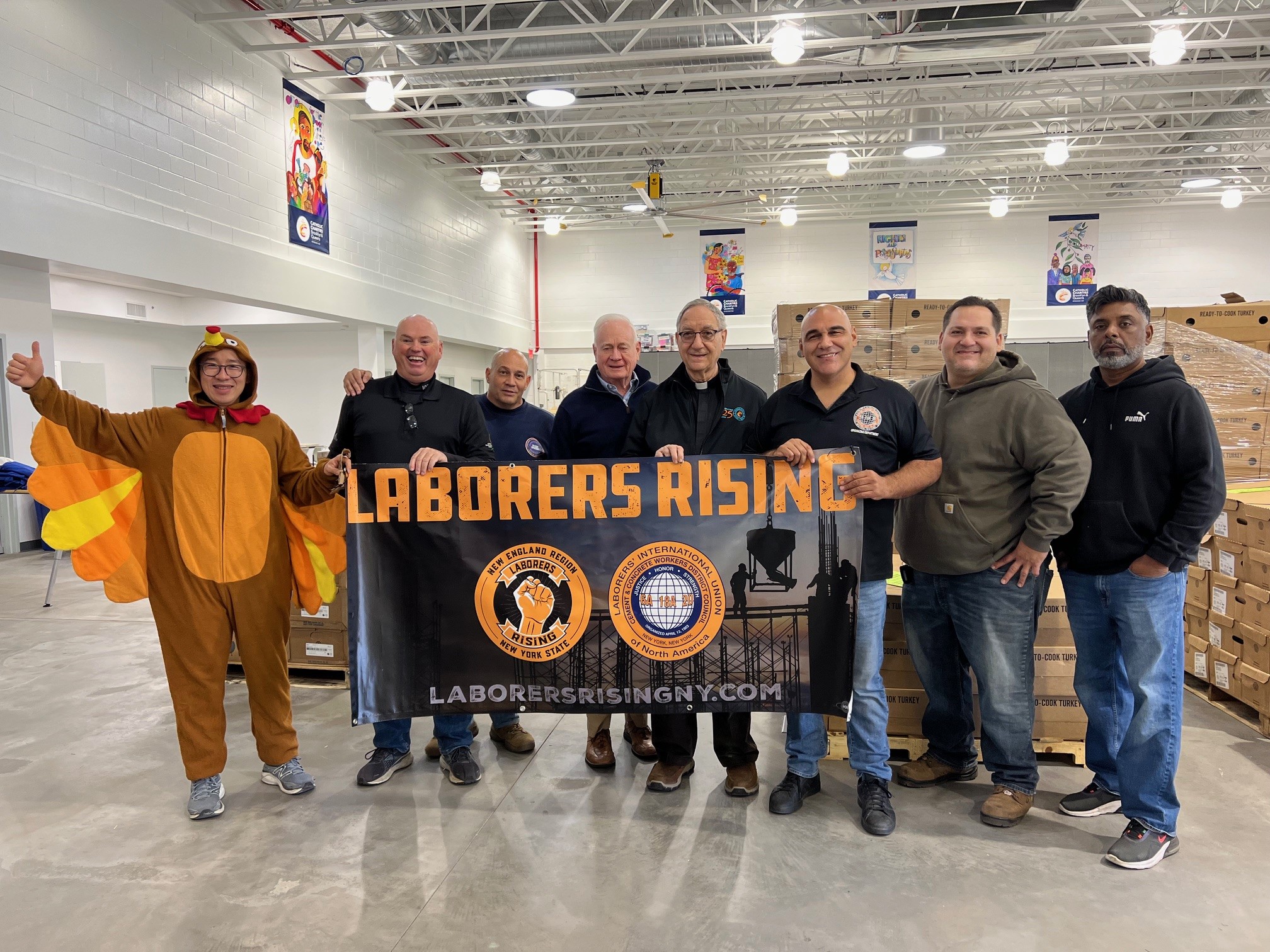 Members of the NYC District Council of Cement and Concrete Workers with Marty Golden, VP of Development, Catholic Charities Brooklyn and Queens (Second from the left), and Monsignor Alfred LoPinto, President and CEO of catholic Charities and Affiliated Agencies (Third from the left).