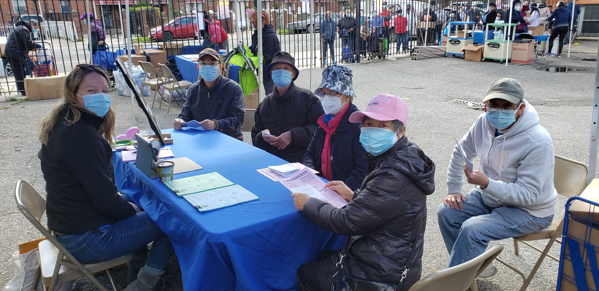 a gathering of people at a pop-up event in chinatown