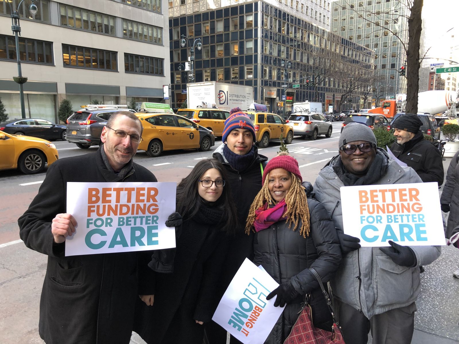 catholic charities staff members at the bring it home rally