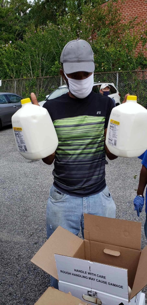 a local brooklyn business donating fresh milk to catholic charities brownsville food pantry