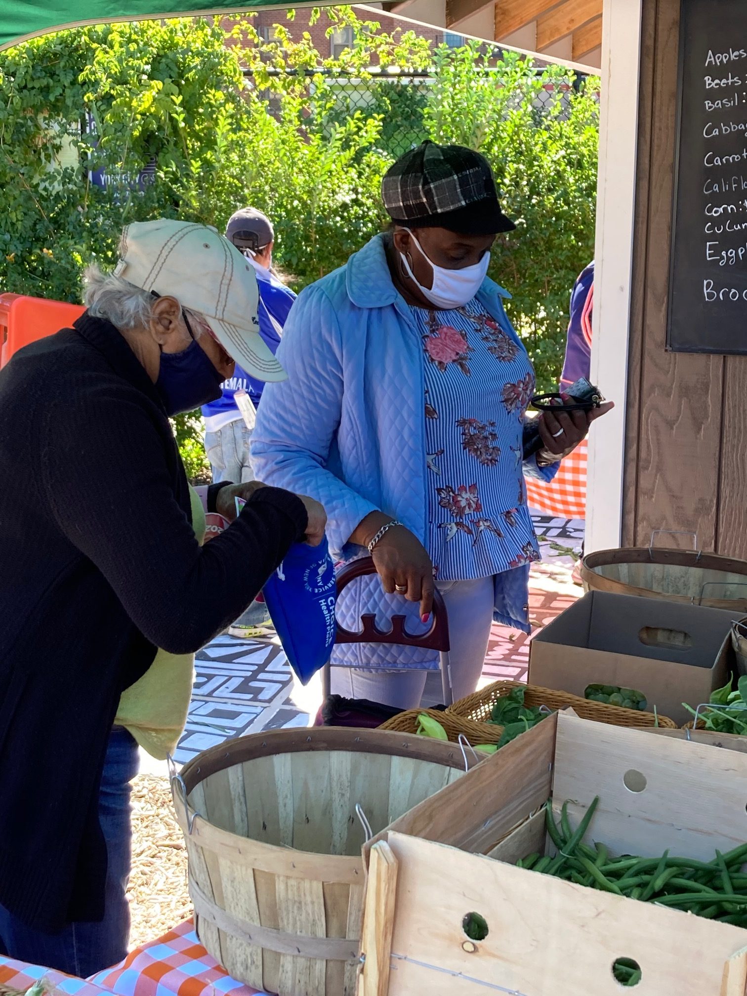guests visiting the greenmarket food pantry with the Greenmarket Walking Tours