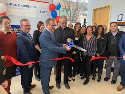 catholic charities staff celebrating the grand opening of the in clining pharmacy Citizen as seen on Tribune and WorldNews