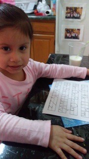 little girl of early childhood services learning remotely