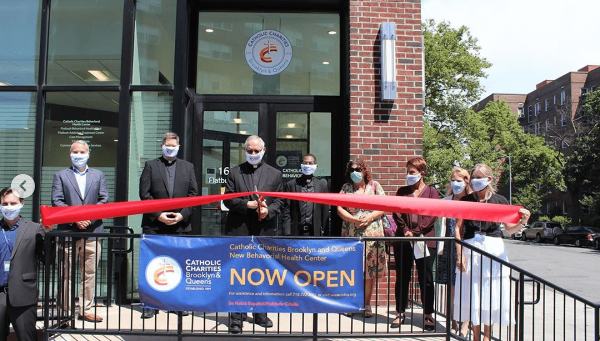 catholic charities staff cutting the ribbon of the new behavioral health center in brooklyn