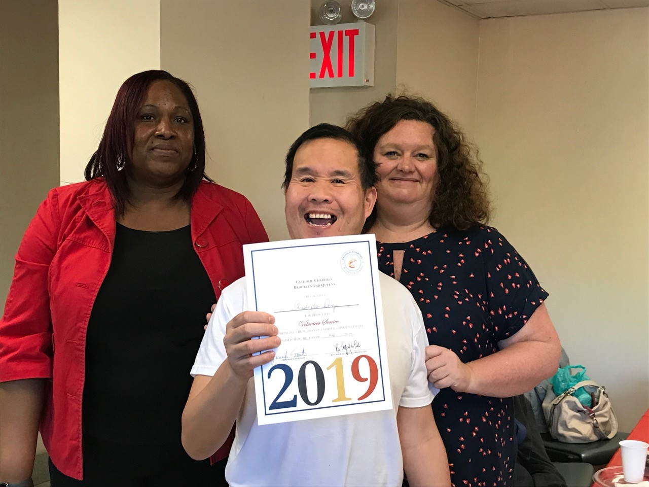 volunteers smiling during the volunteer appreciation luncheon in queens