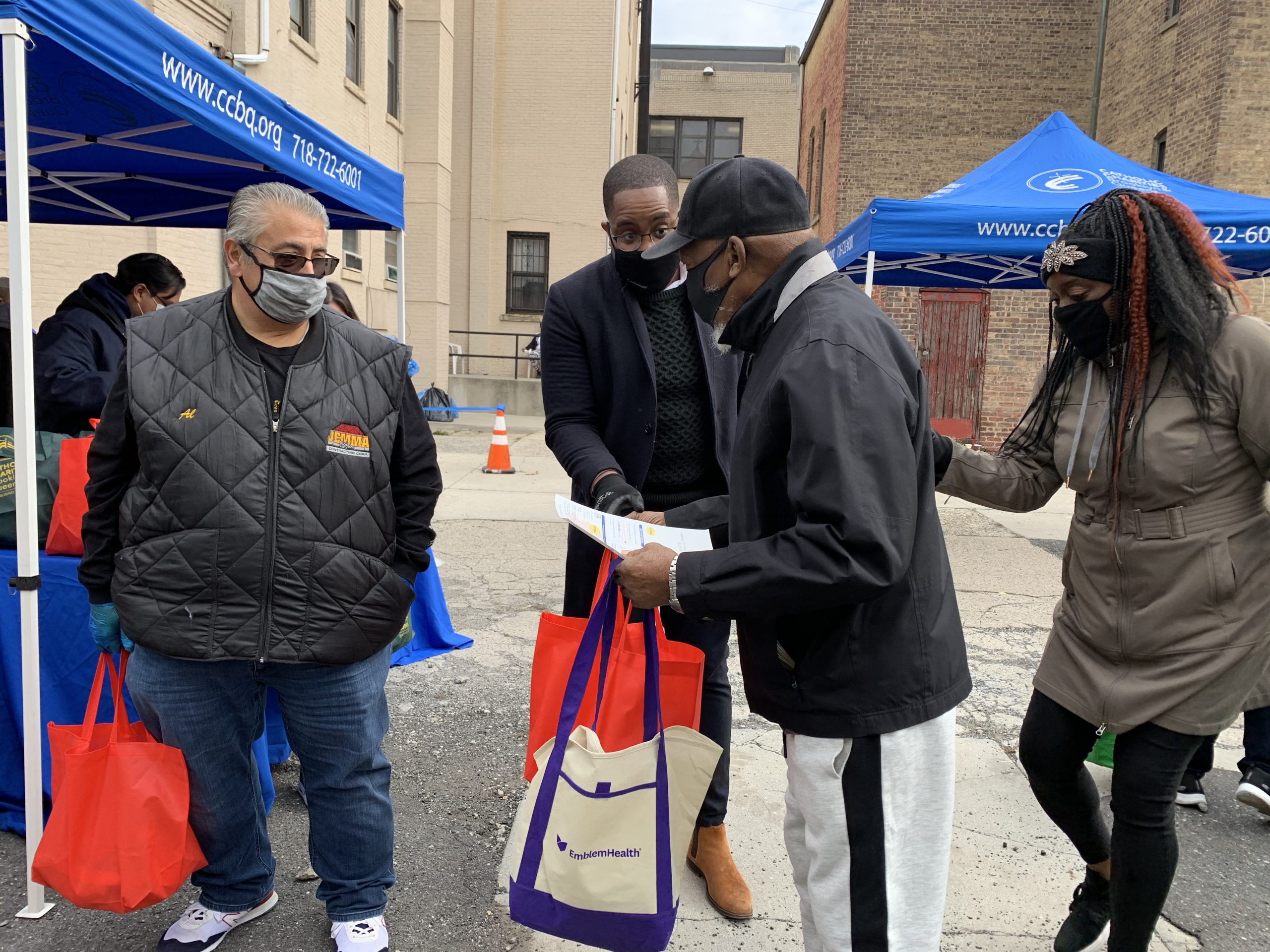 catholic charities food and goodies distribution at a pop up event