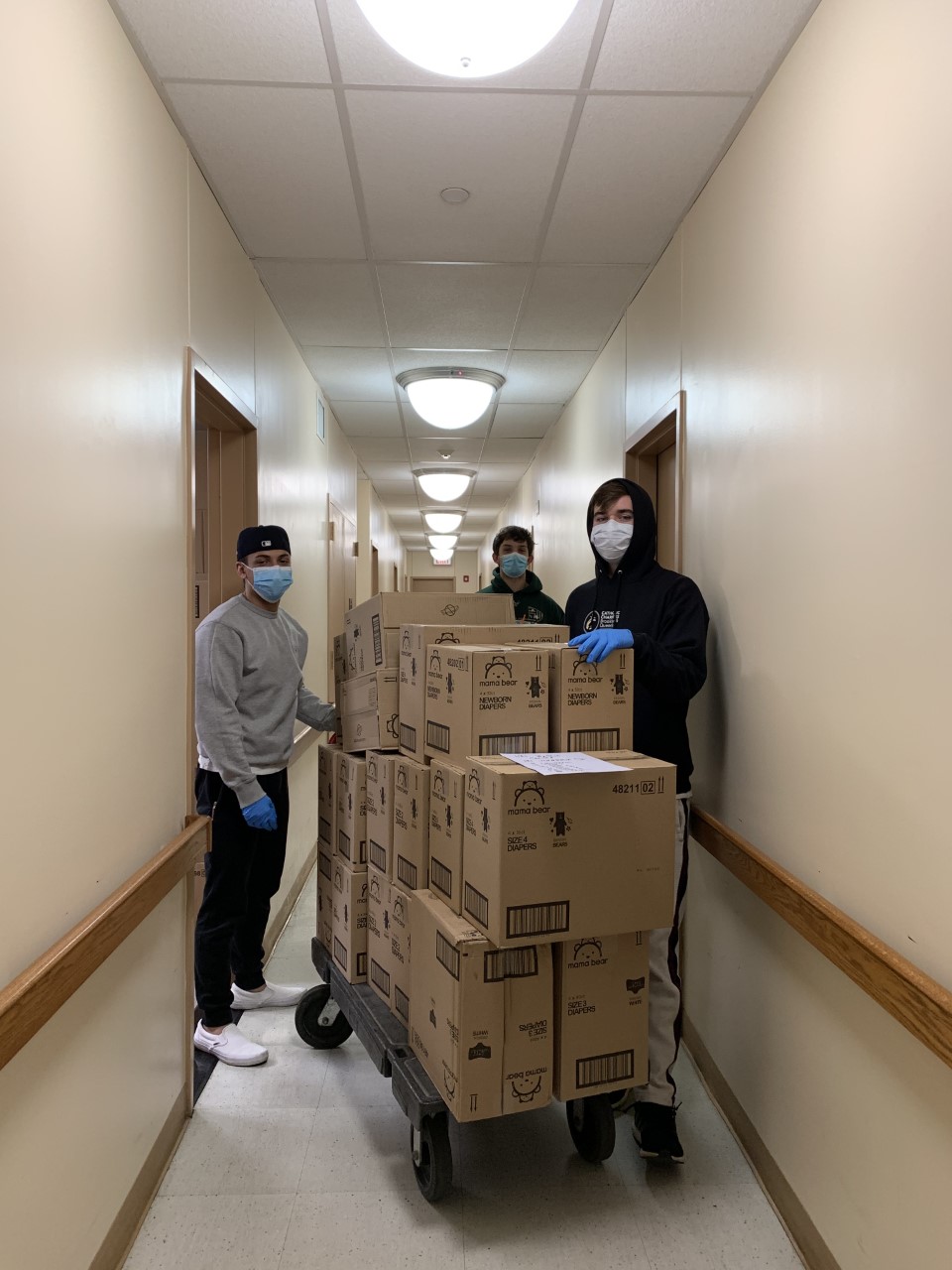 catholic charities receives cases of diapers to help families in need