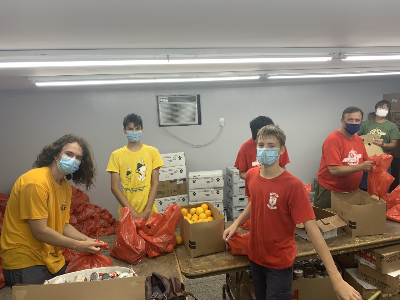 Boy scout troup 23 volunteering at our food pantry