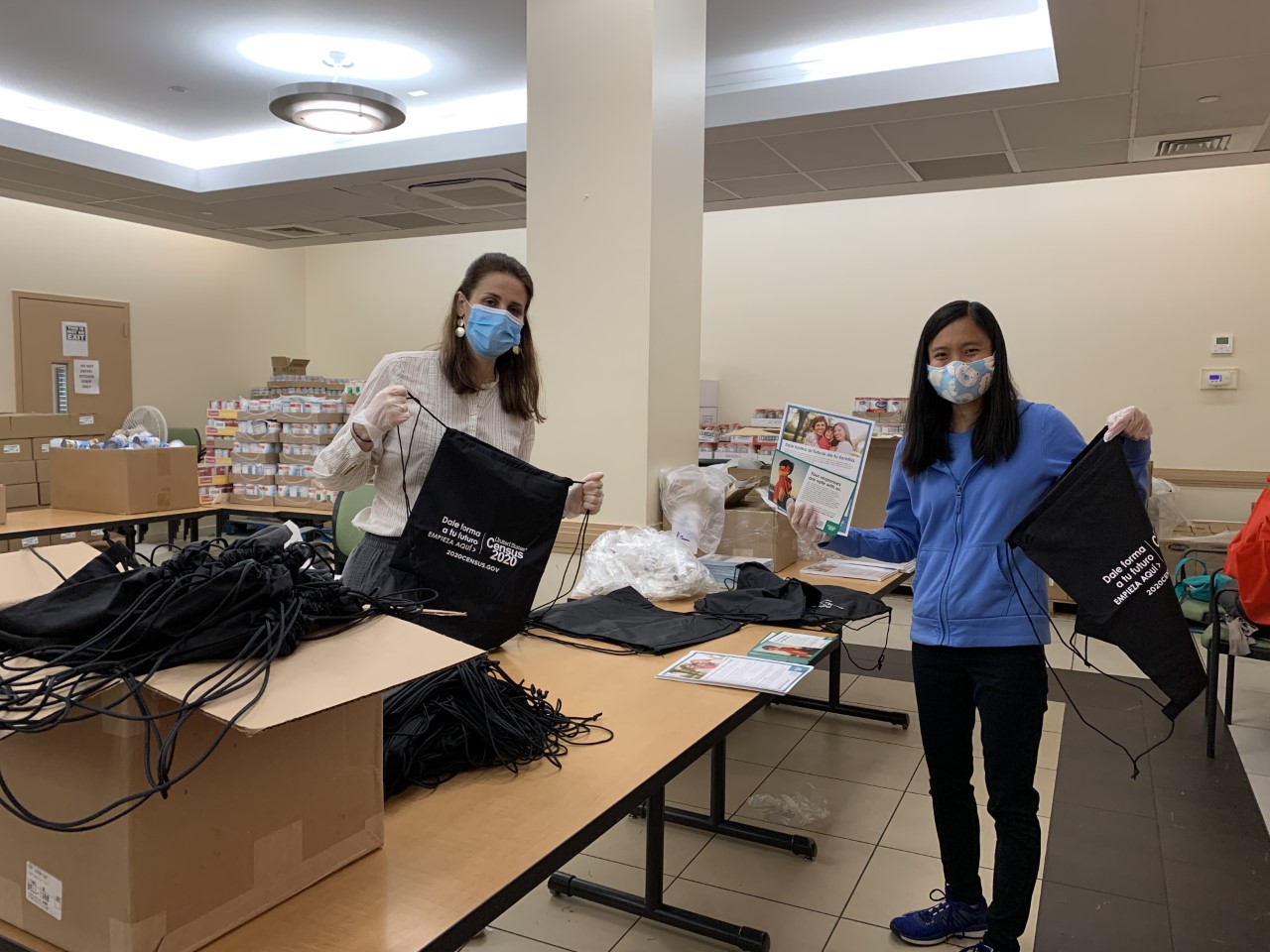 census team preparing brag and go bags with fresh produce