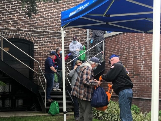 ccbq staff members distributing food at sunset park brooklyn