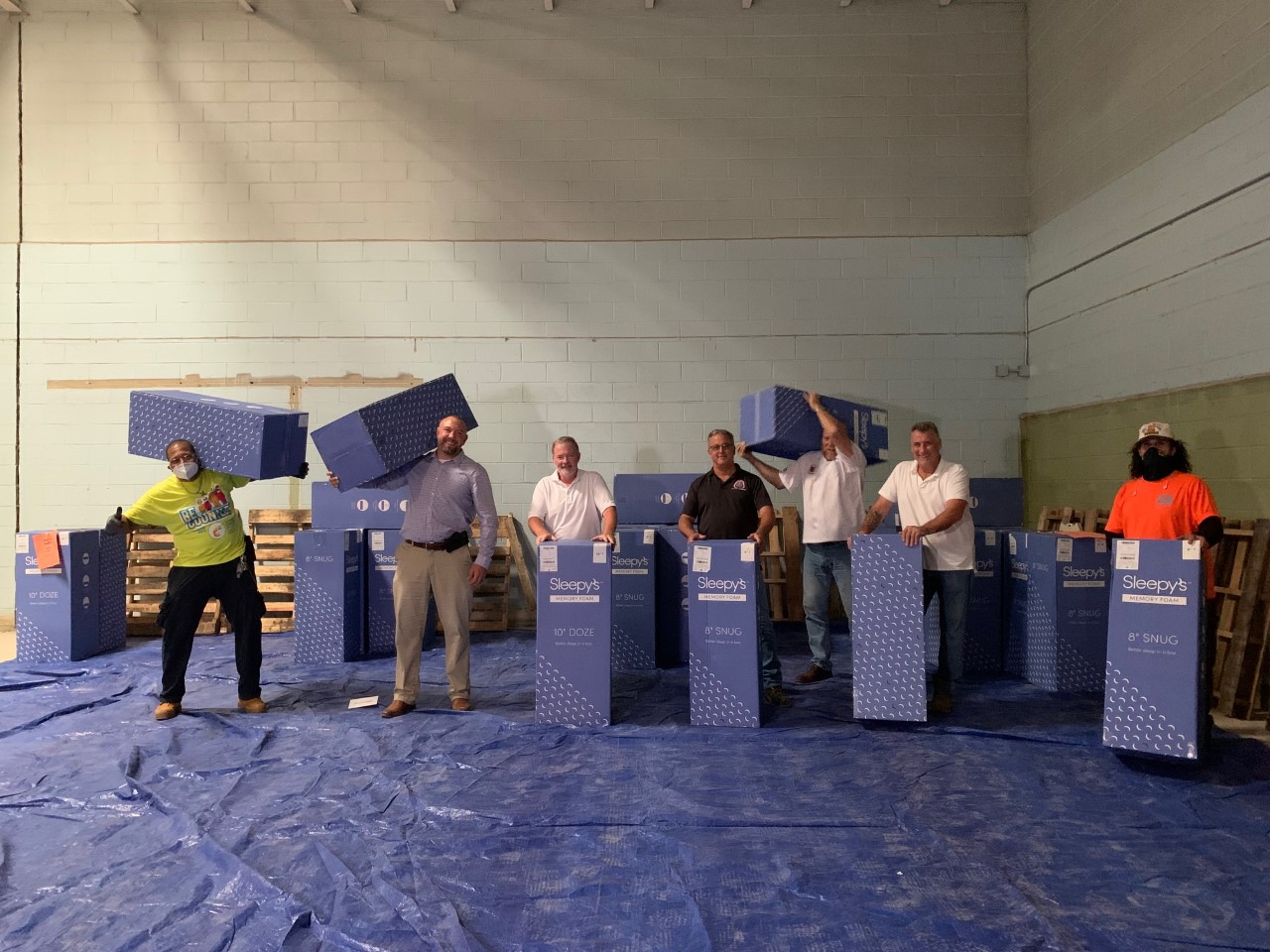 Mattress donation with delivery staff and volunteers