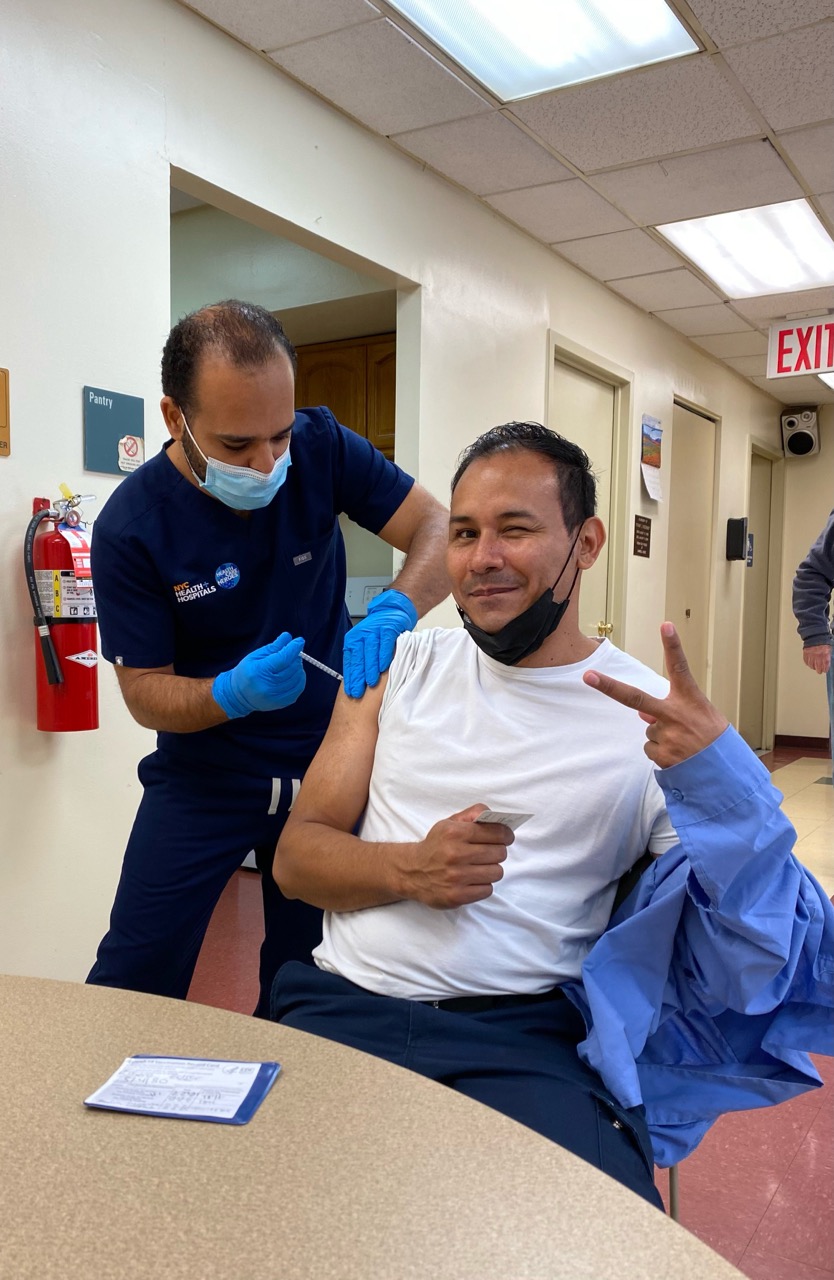 Catholic Charities resident receives vaccination.