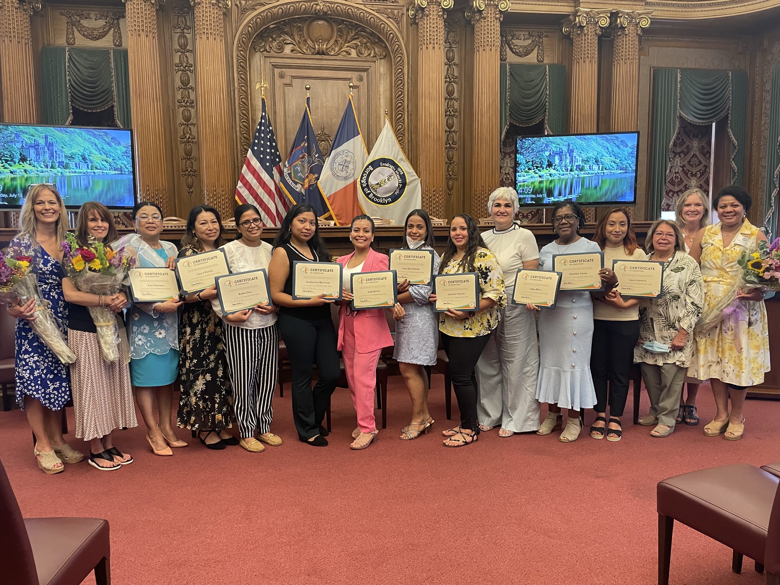 montessori teachers holding their certificates