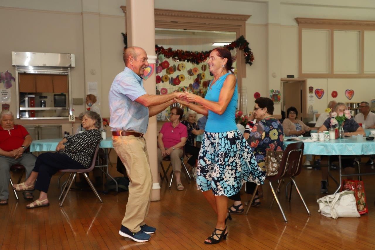 Seniors enjoy dancing, music, bonding and more at August birthdays celebration.