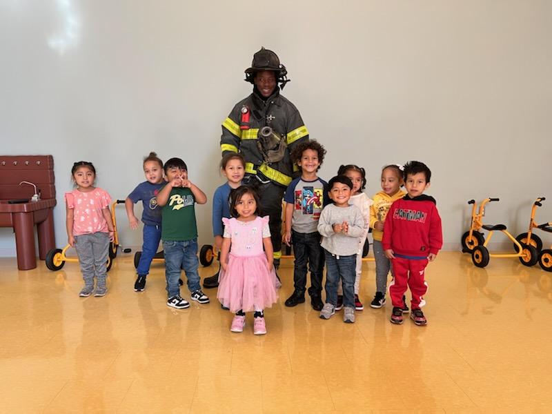 New York City Fire Department (FDNY)'s Recruiter Firefighter Kievon Harper. Mr. Harper with our children of the center.