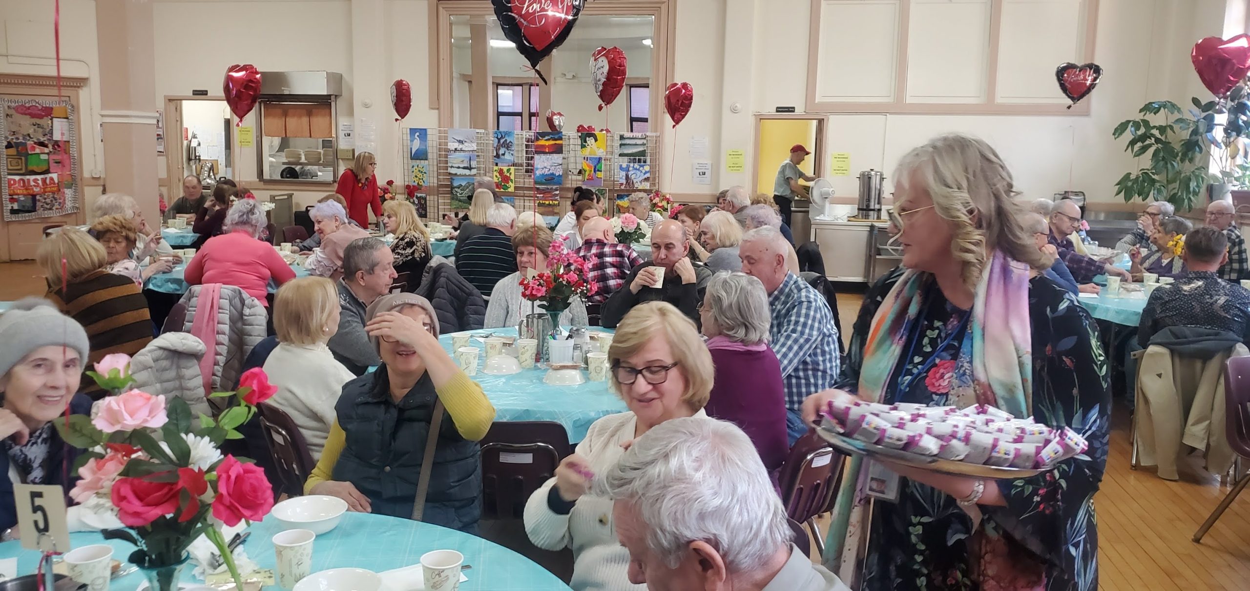 residents of the pete mcguinness older adult center celebrating international women's day
