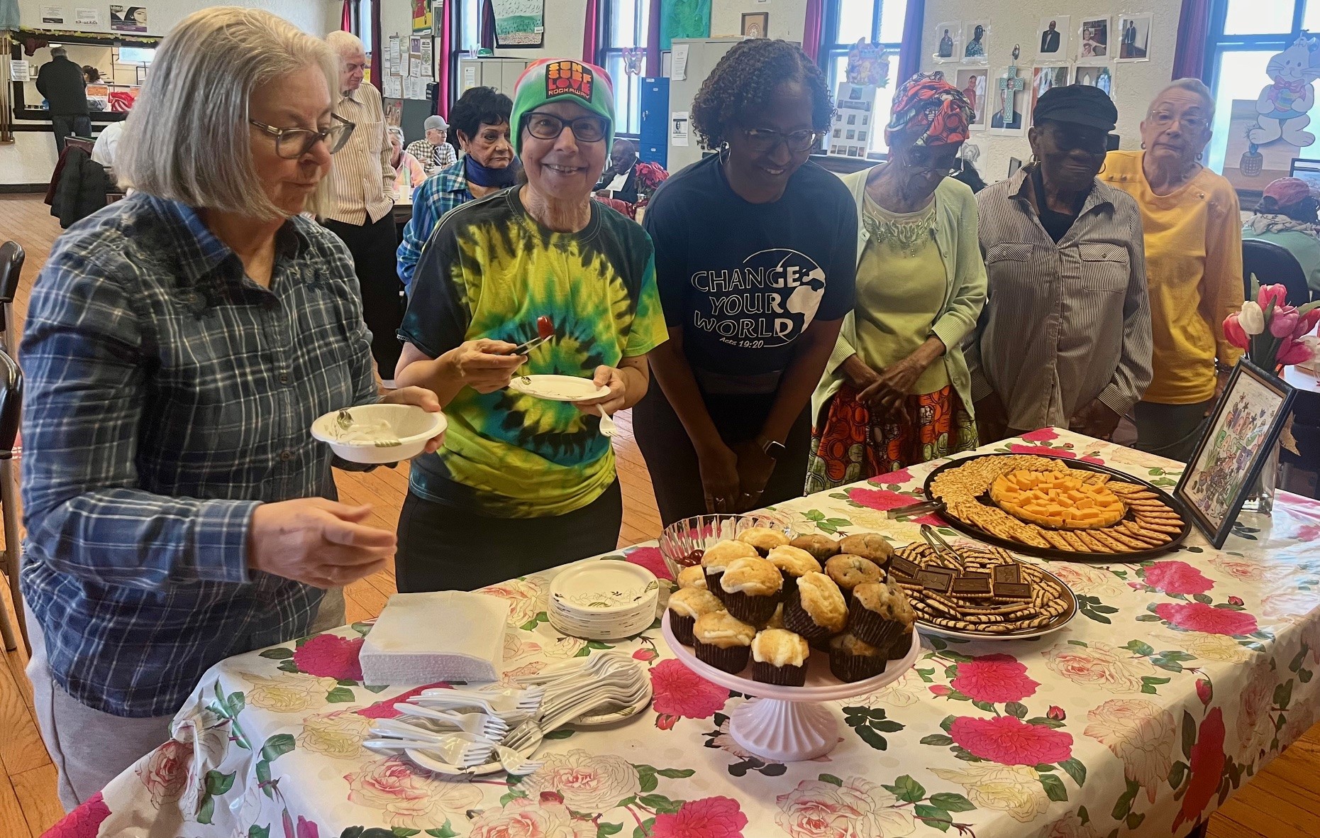 members of the seaside older adult center having food and celebrating spring season