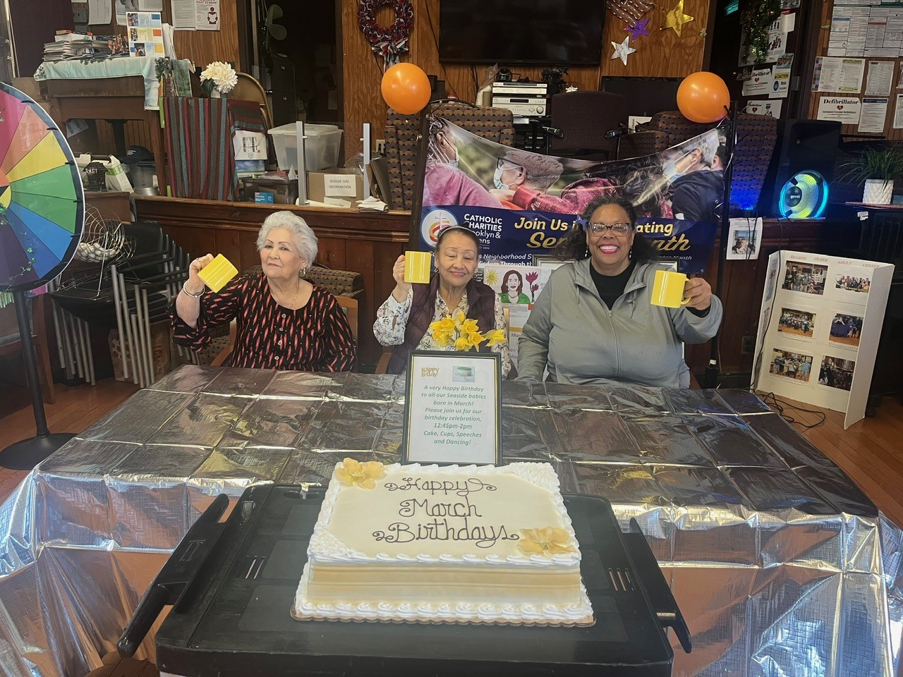 three members of the seaside older adult center celebratin their birthday in march