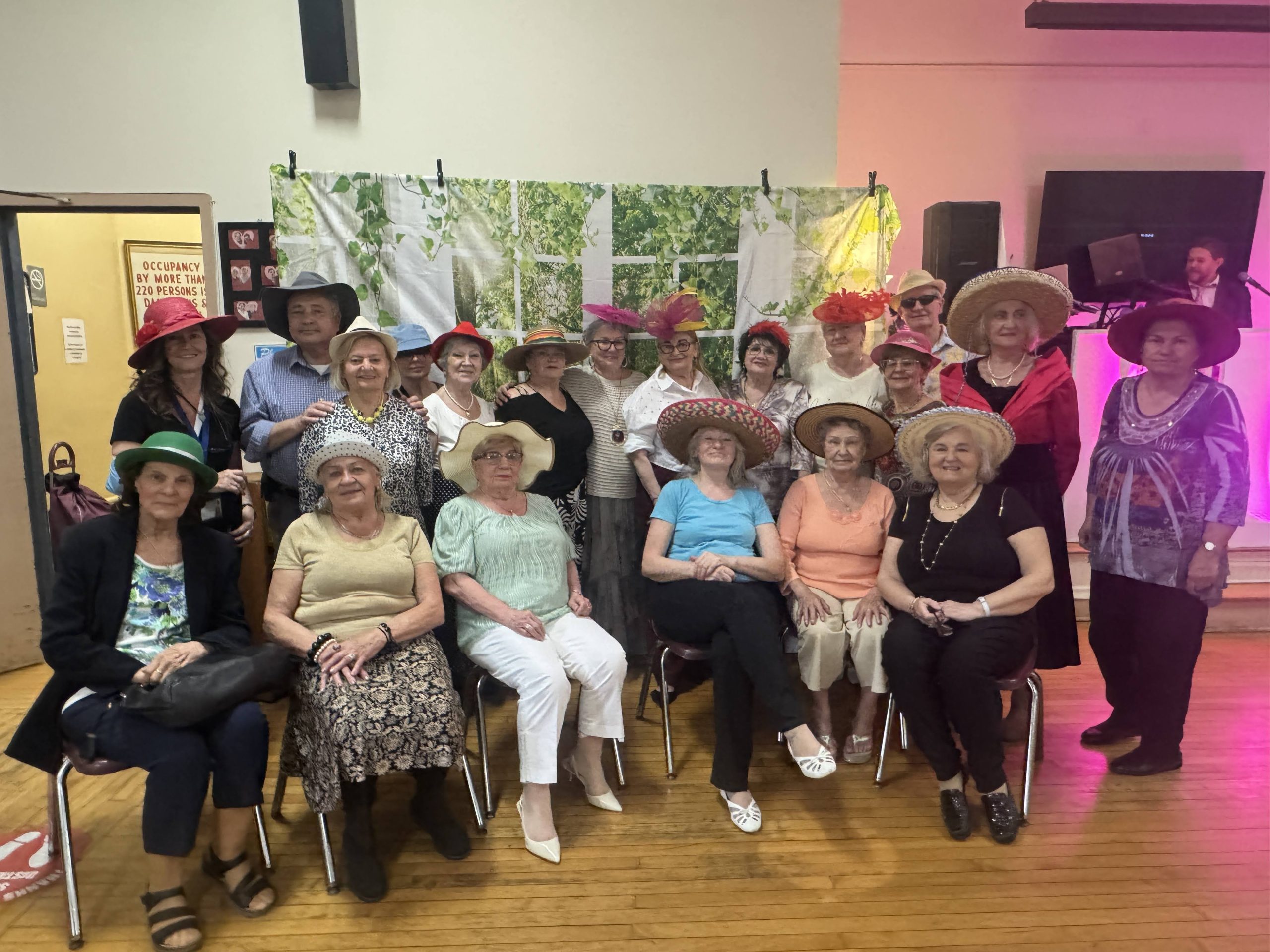 senior residents with funny hats are celebrating older americans month