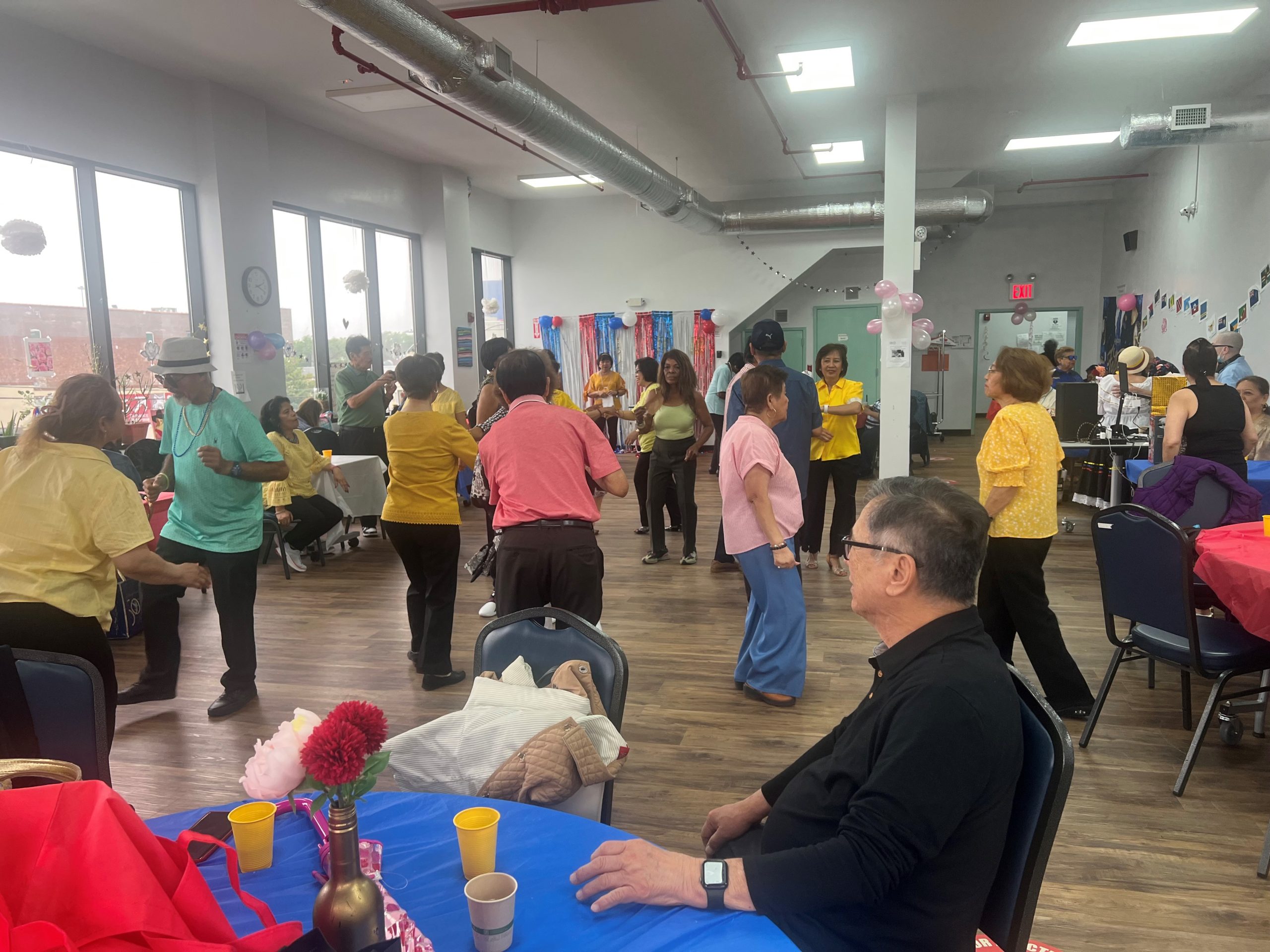 families and friends celebrating father's day at the hillcrest older adult center