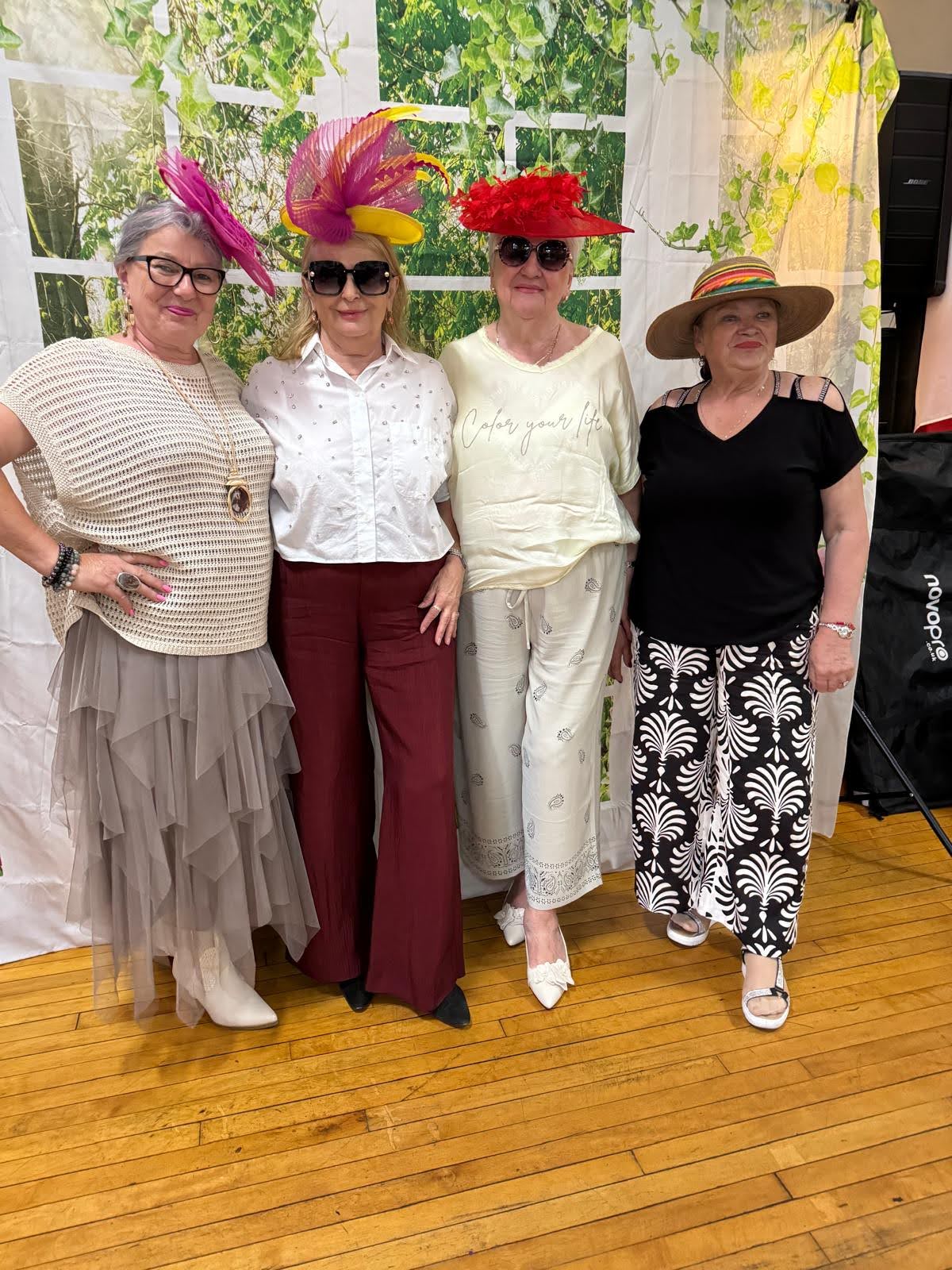 senior residents ladies wearing fancy hats during older americans month