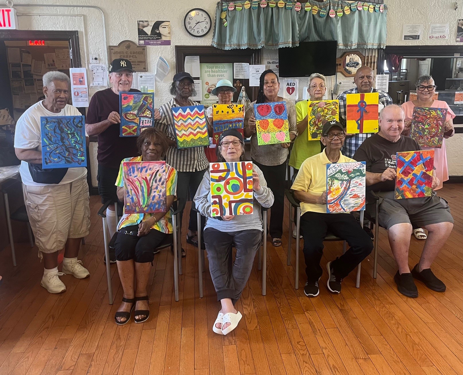 Seaside Older Adult residents showcasing their painting