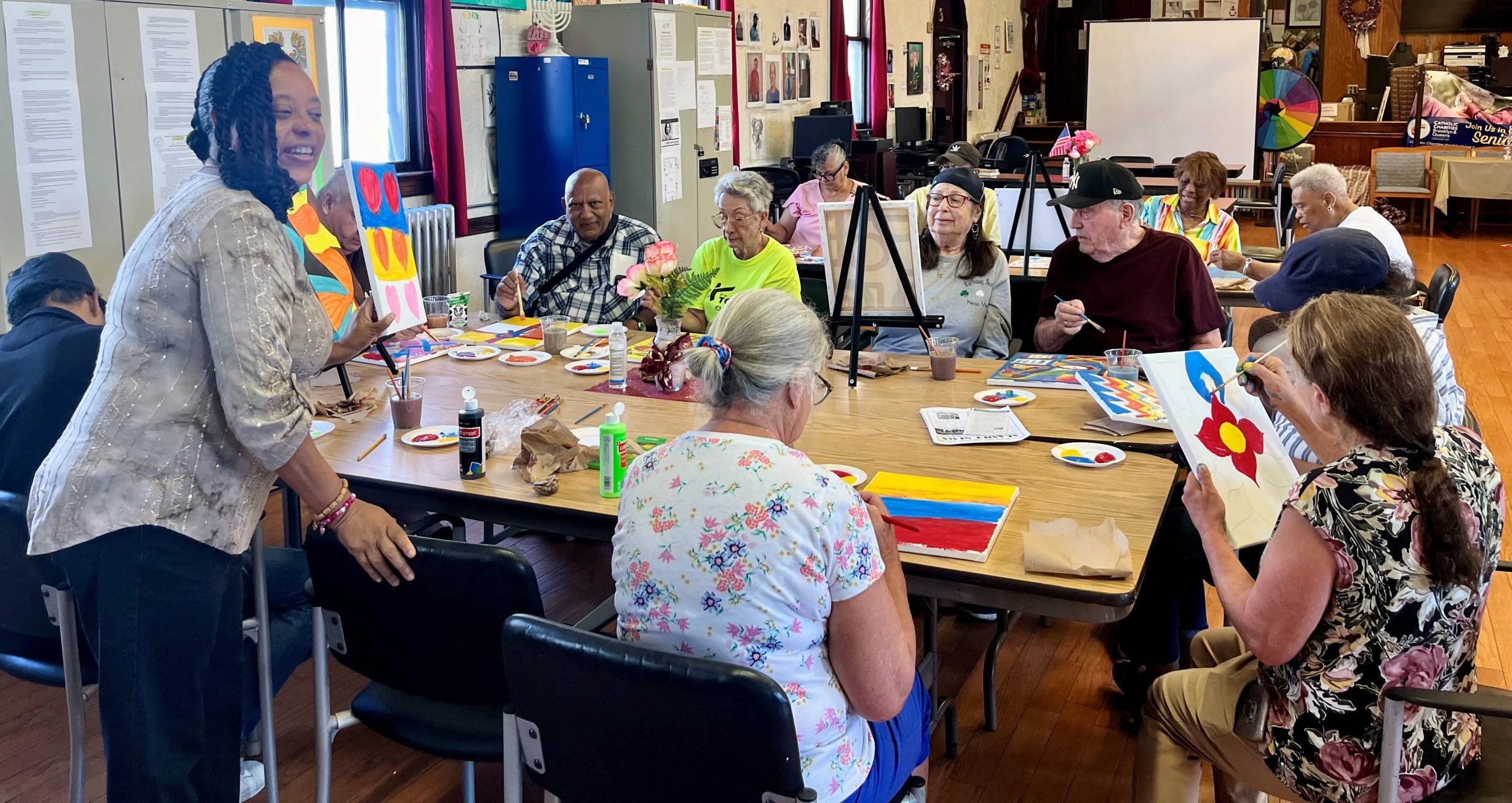 Seaside older adult residents painting