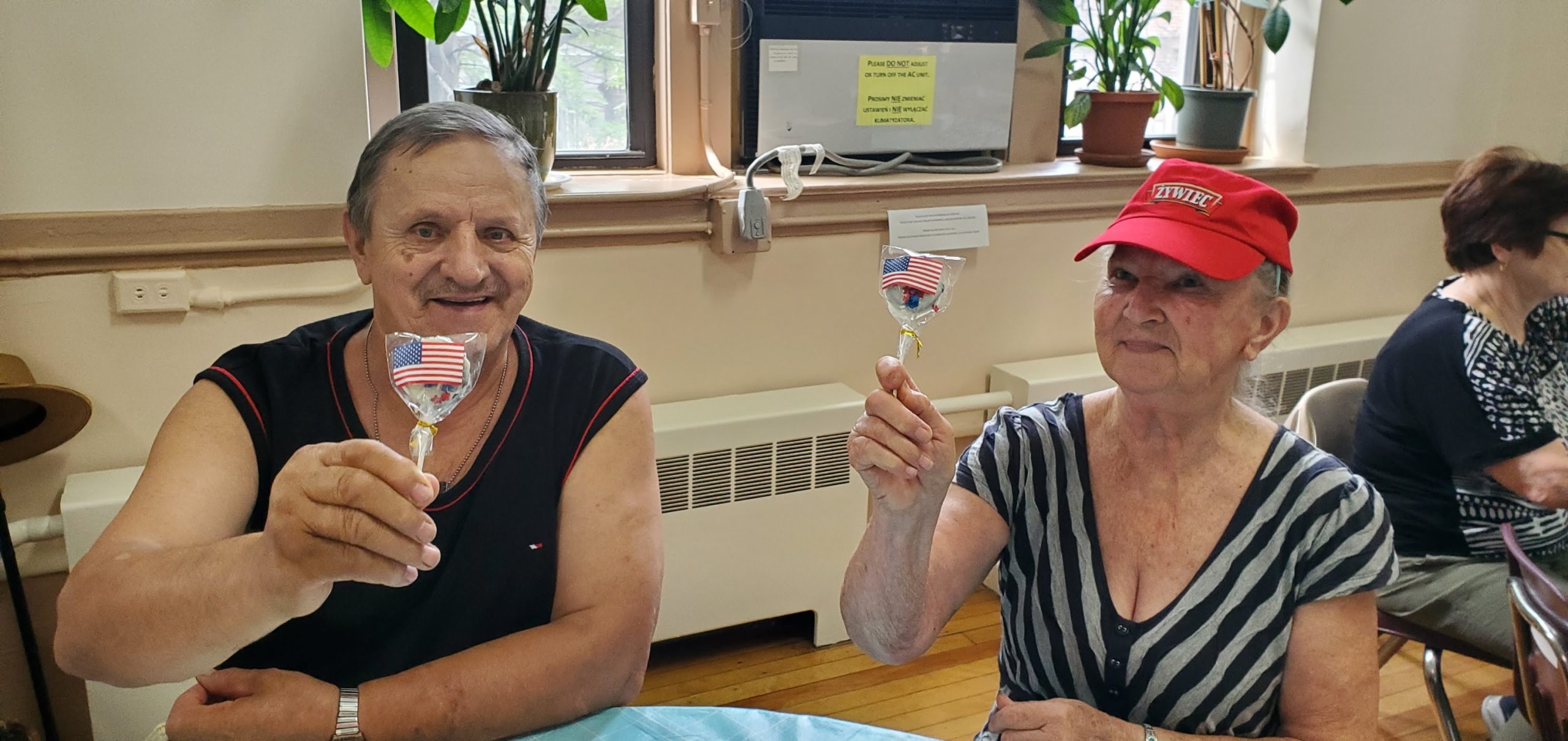 senior residents showing a lollipop