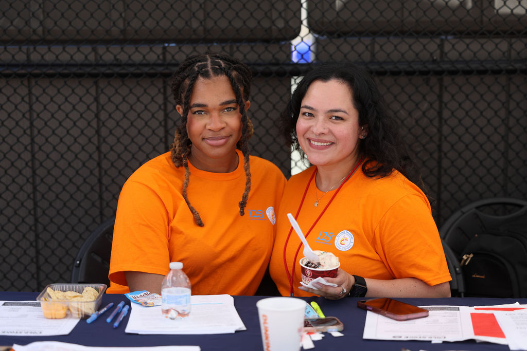 Two catholic charities volunteers smiling