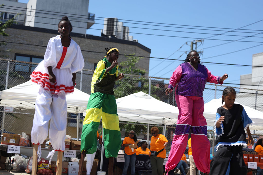 Stilt walkers at the annual health and wellness family fun day