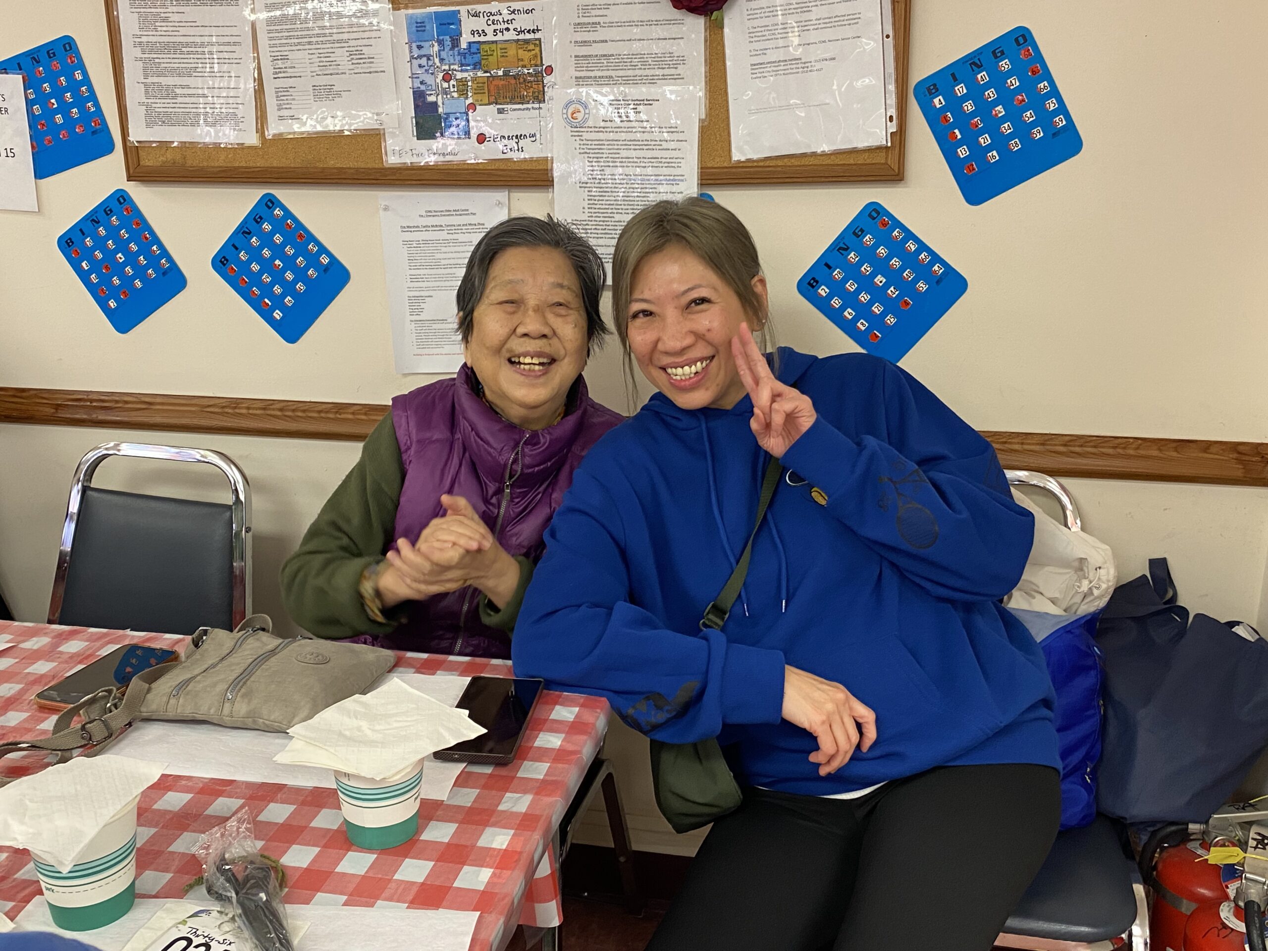 mother and daughter smiling and having fun during mid-winter event at narrows older adult center