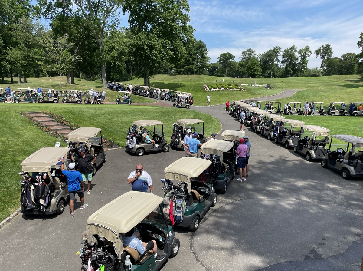 view of a golf course with carts